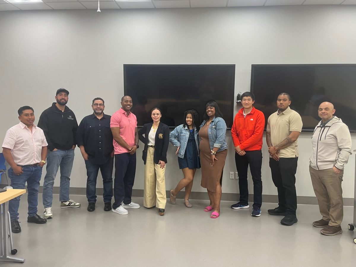 Business owners and the Roads team after a program session