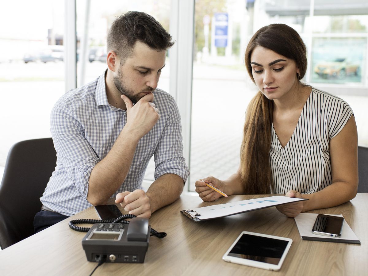 Advisor reviewing loan documents with a small business owner